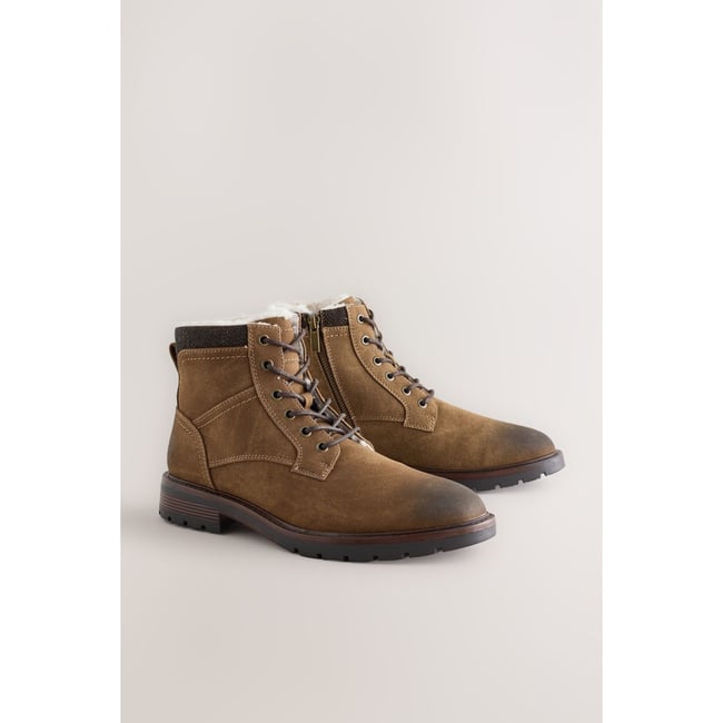 Bottes hautes zippées doublées de peau lainée marron fauve <span itemprop=