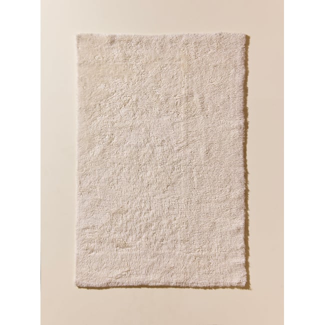 Petit tapis poils longs pure laine Couleur beige clair uni <span itemprop=