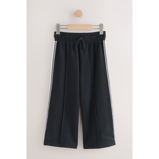 Pantalon de jogging large rayures sur le côté noir <span itemprop=