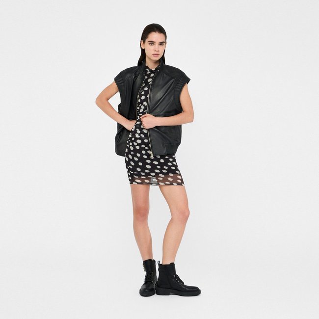 Veste sans manches oversize en cuir noir <span itemprop=