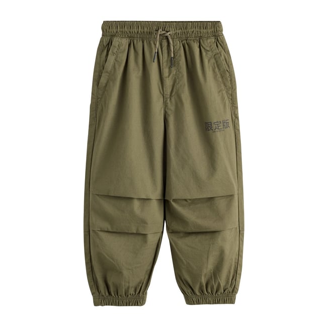 Pantalon parachute ultra-large vert kaki <span itemprop=
