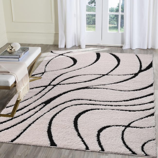Tapis rond shaggy tissé motif géométrique POUDA - UN AMOUR DE TAPIS