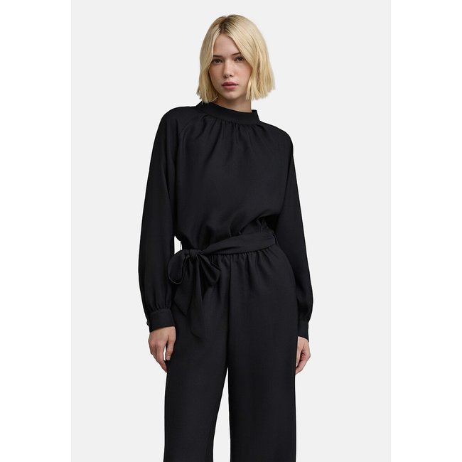 Langärmeliger Overall schwarz <span itemprop=