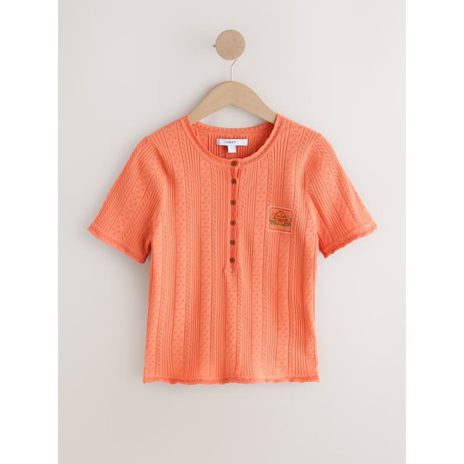 T-shirt en maille pointelle à col tunisien détails brodés orange <span itemprop=