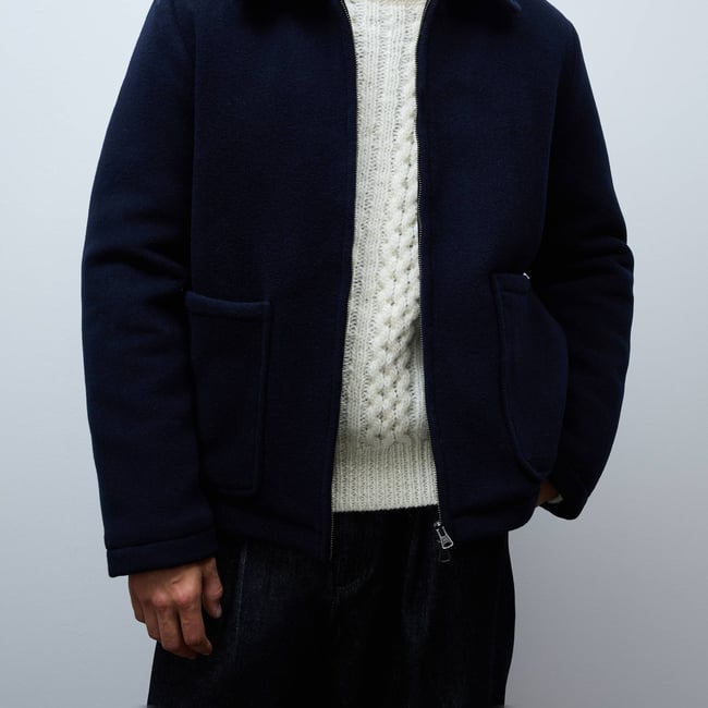 Veste zippé contenant de la laine marine <span itemprop=
