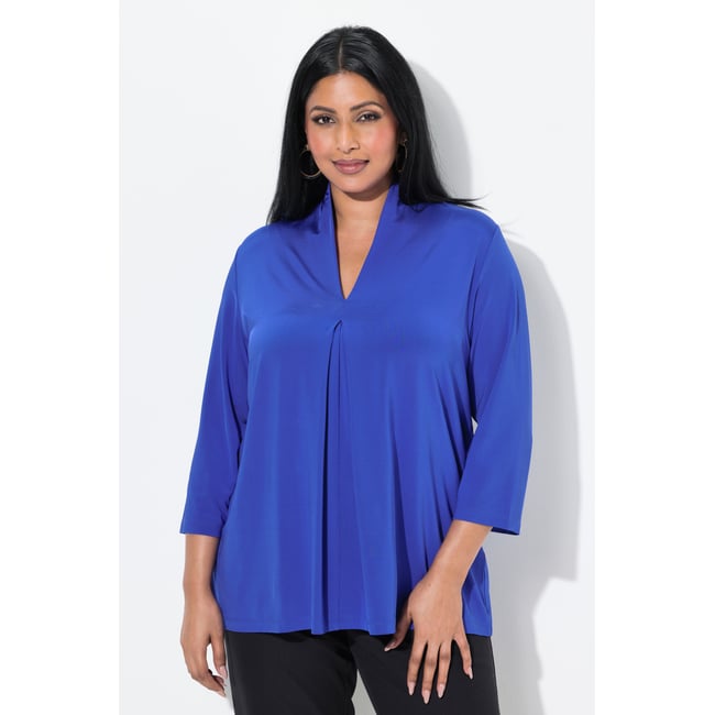 Blouse au tombé fluide. Col cygne et manches bleu violet <span itemprop=