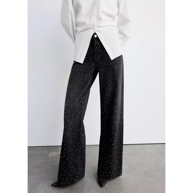 Jean large à strass black denim <span itemprop=