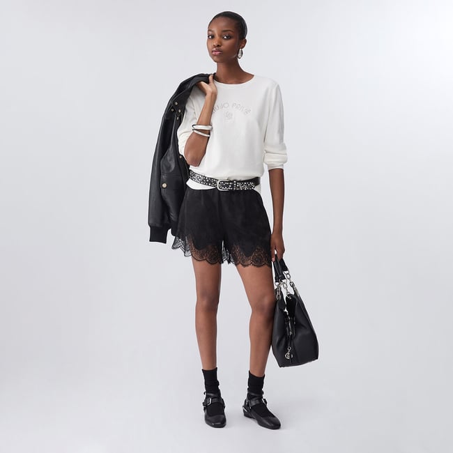 Haut avec micro paillettes blanc laine <span itemprop=