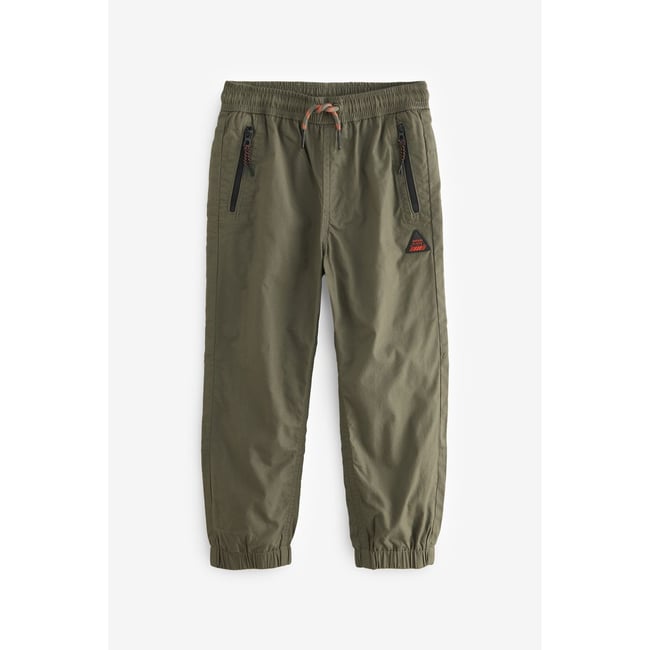 Pantalon à enfiler avec poches zippées vert kaki <span itemprop=