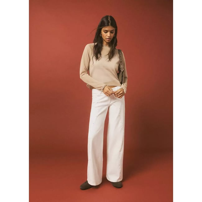 Jean taille basse à clous blanc <span itemprop=