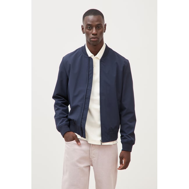 Blouson manches longues doublé bleu marine <span itemprop=