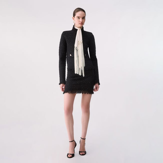 Minijupe en maille noir <span itemprop=