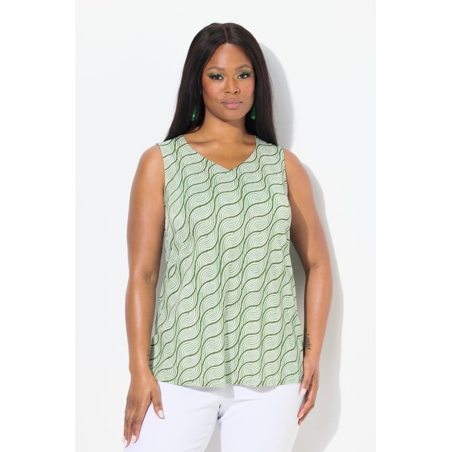 Débardeur en tissu fluide. Encolure en forme petit pois <span itemprop=