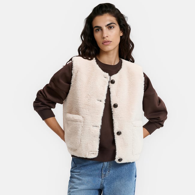 Veste col rond, sans manches, en sherpa beige <span itemprop=