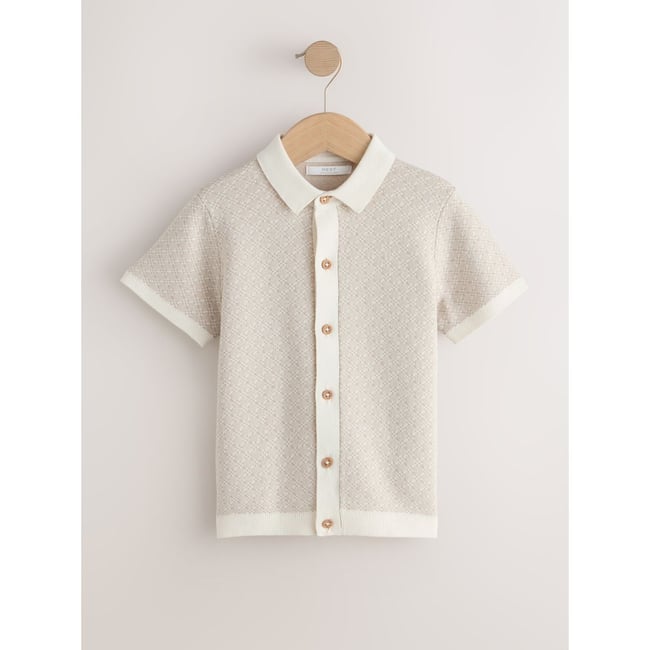 Polo boutonné en maille ecru géo <span itemprop=
