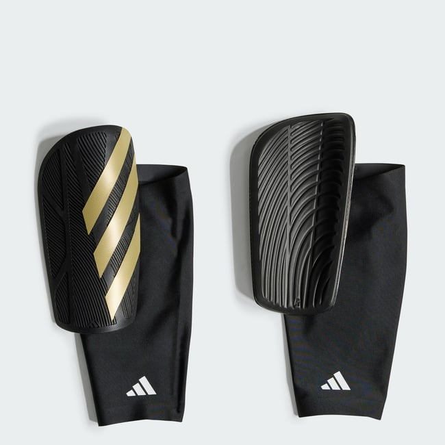 Protège-Tibias Tiro Competition Protège-Tibias Tiro Competition black / gold metallic / white <span itemprop=