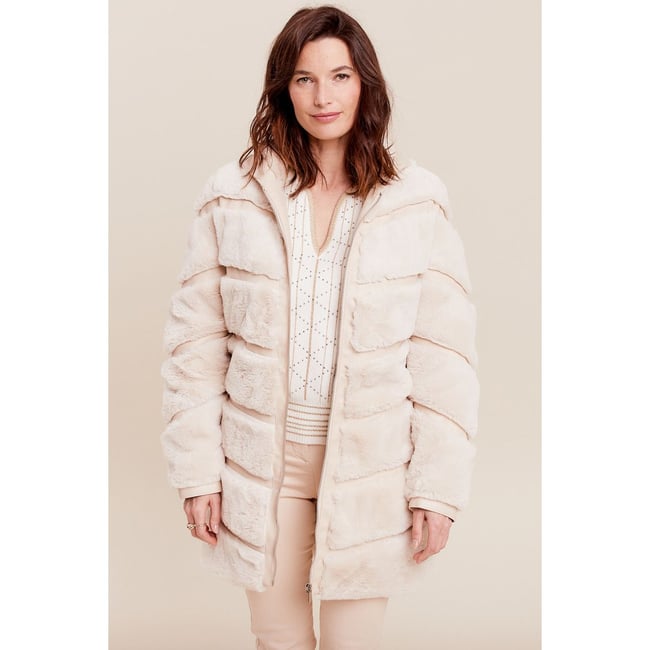 Manteau fausse fourrure ivoire <span itemprop=