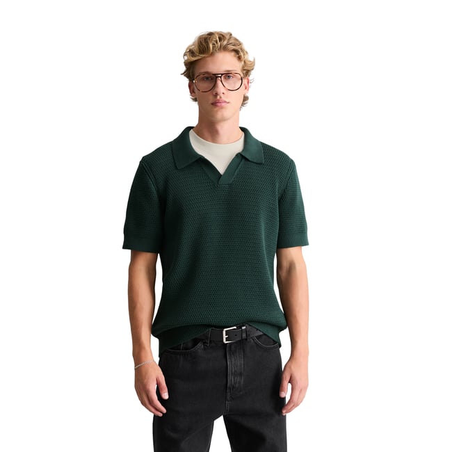 Polo en tricot DfC relaxed avec une structure tricotée aérée vert foncé <span itemprop=