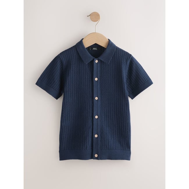 Polo boutonné en maille bleu marine <span itemprop=