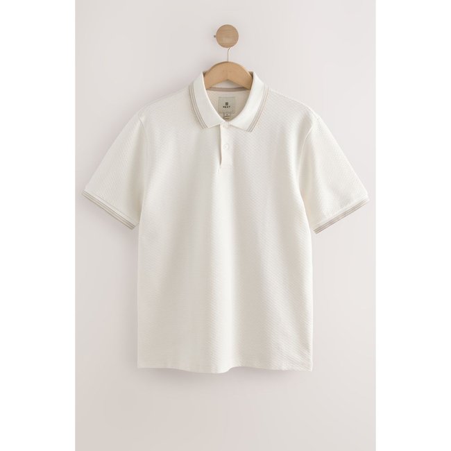 Polo texturé à manches courtes avec zip 3/4 pointe blanche <span itemprop=