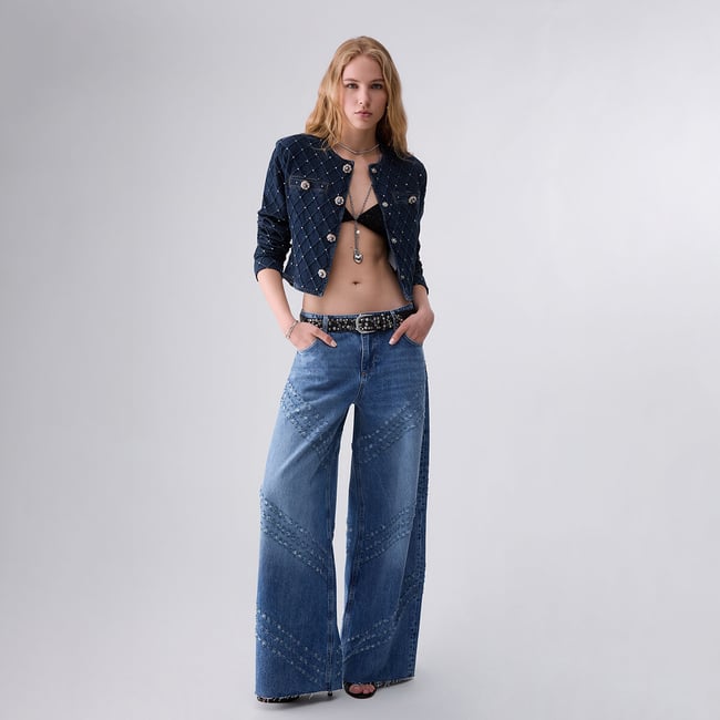 Jean évasé avec détails gravés au laser denim bleu <span itemprop=