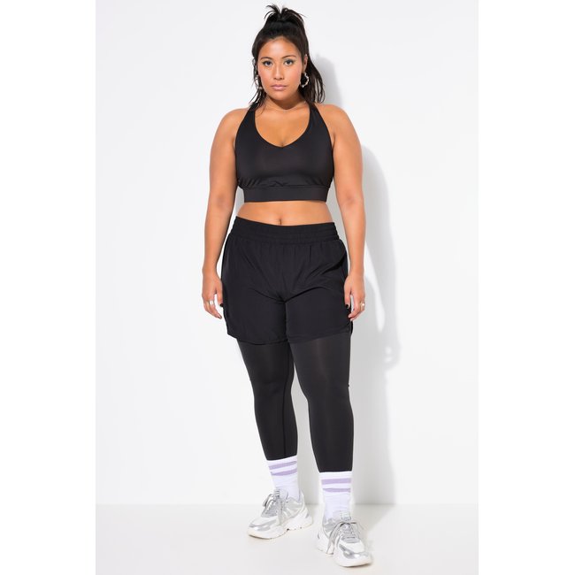 Collant de sport avec short. Coupe slim et noir <span itemprop=
