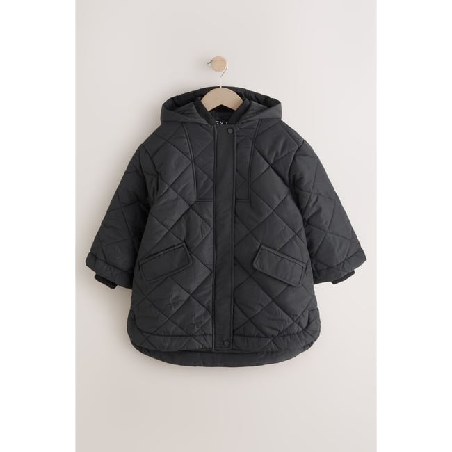 Manteau sans manches à matelassage losanges noir <span itemprop=