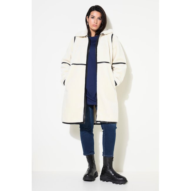 Veste en polaire bouclée. Passepoil en cuir blanc cassé <span itemprop=