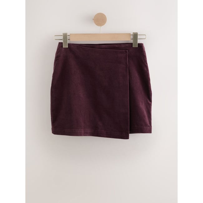 Jupe portefeuille courte en velours côtelé prune <span itemprop=