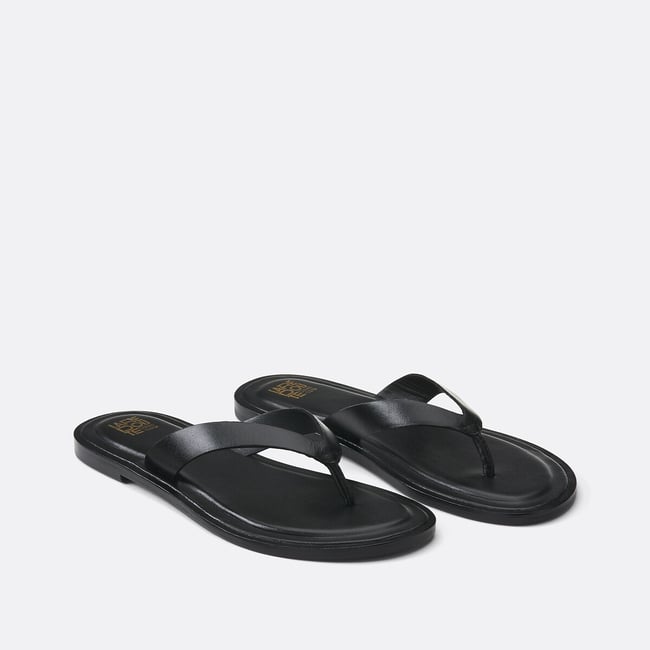Mules plates entre-doigts noir <span itemprop=