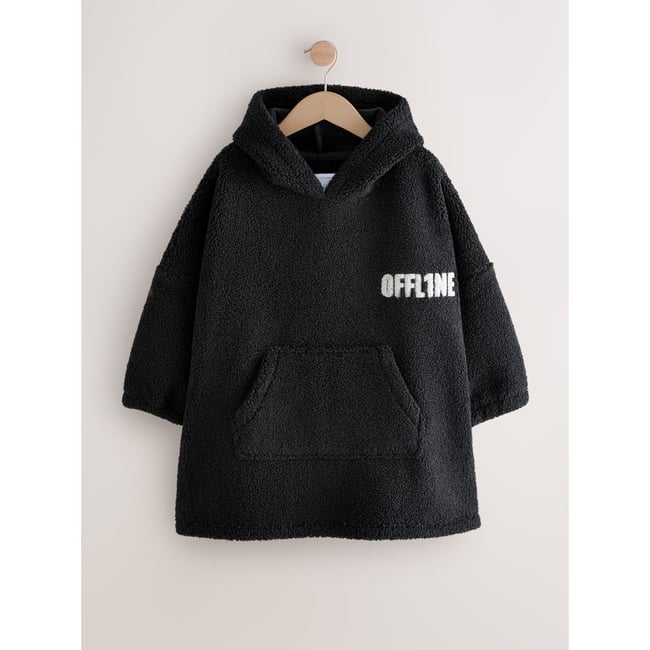 Poncho en polaire noir hors ligne <span itemprop=