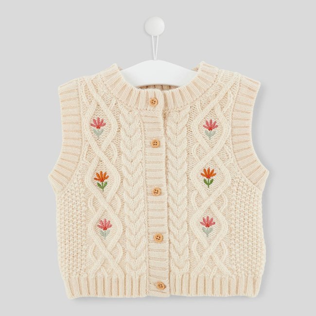 Pull sans manche brodé, contient de la laine naturel <span itemprop=
