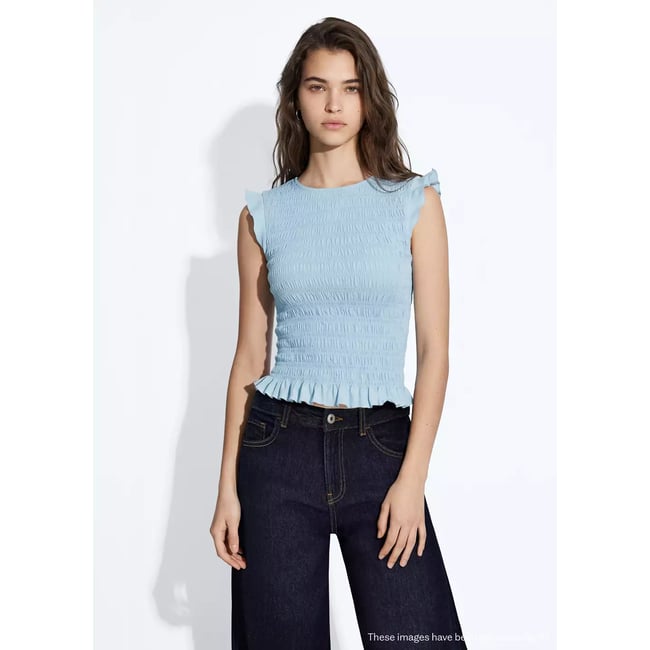 Top froncé détail volant bleu ciel <span itemprop=