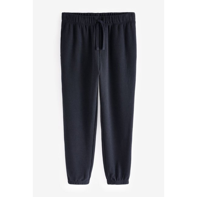 Bas de pyjama gaufré bleu marine <span itemprop=