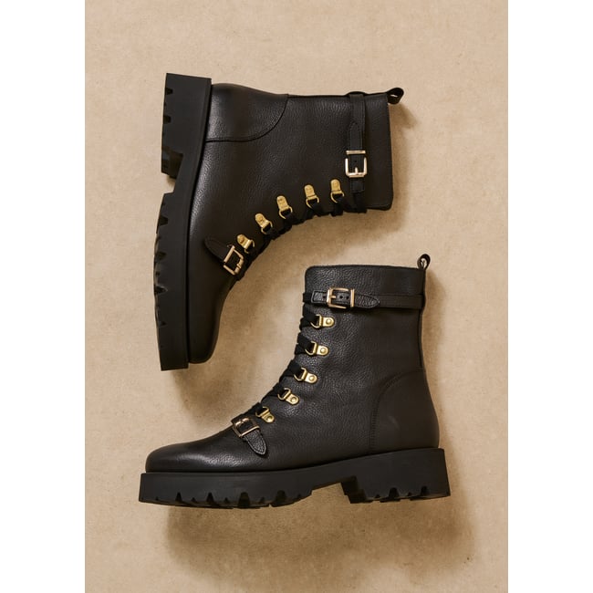 Bottes zippées en cuir à talons noir <span itemprop=