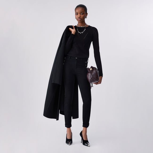 Jeans skinny avec boutons décoratifs denim noir <span itemprop=