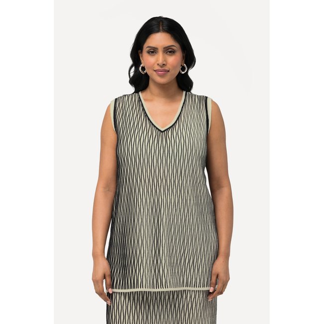 Débardeur en maille. Décolleté en V. Laine blanc cassé <span itemprop=