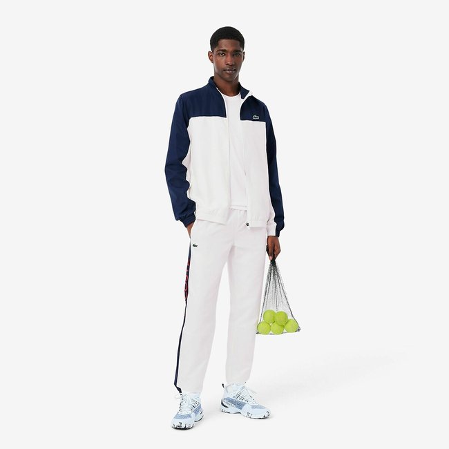 Sport-Trainingsanzug mit Lacoste-Logos marine/weiss <span itemprop=