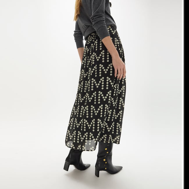 Jupe plissée imprimée à pois avec boucle personnalisée noir <span itemprop=