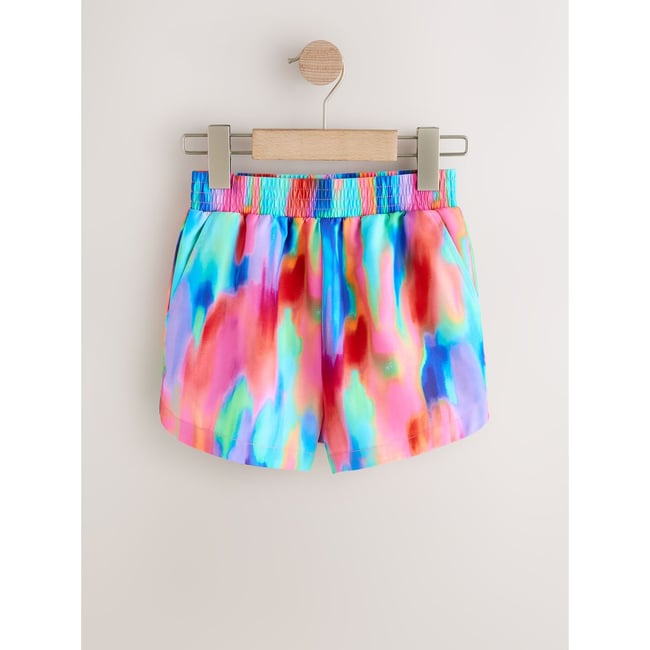 Short de plage tie-dye arc-en-ciel <span itemprop=