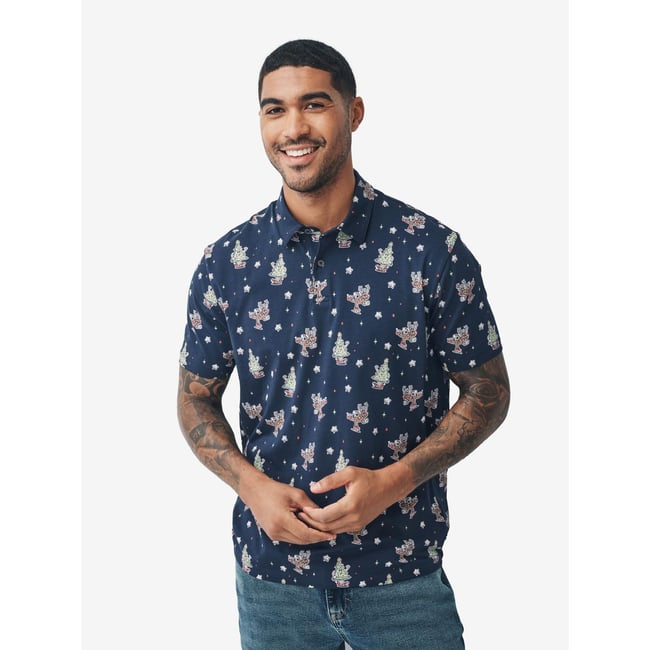 Polo de noël renne bleu marine <span itemprop=