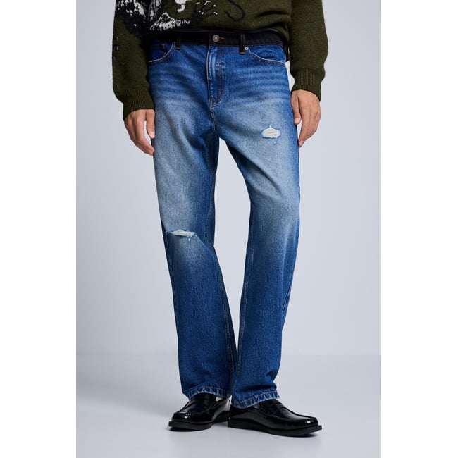 Jean à double taille bleu clair <span itemprop=