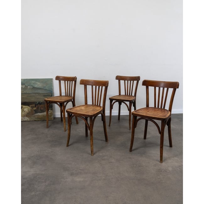 Lot de 4 chaises en bois Luterma Claude N°1365 - Bon état Couleur bois foncé <span itemprop=