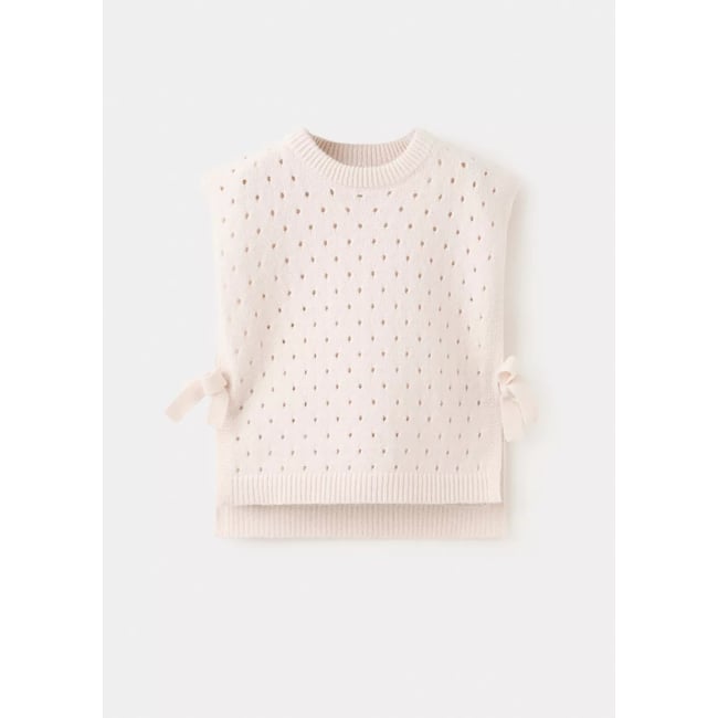 Gilet en maille ajourée avec nœuds ivoire <span itemprop=