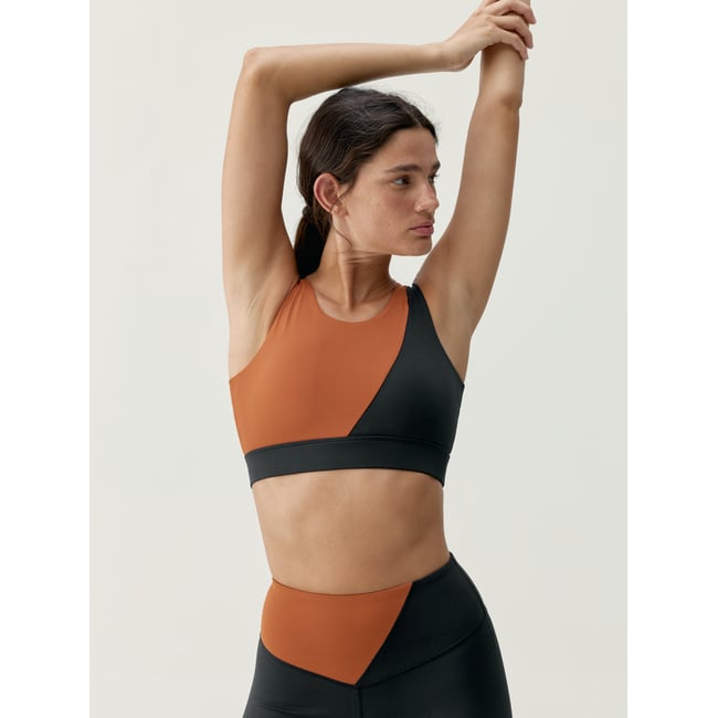 Brassière de sport femme Omkara Maintien moyen-élevé séchage rapide noir/tuile <span itemprop=