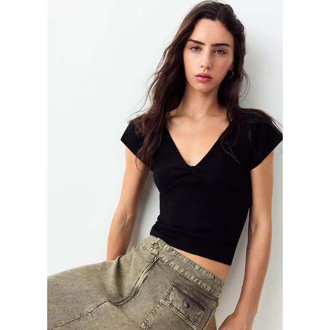 Top en maille col V noir <span itemprop=