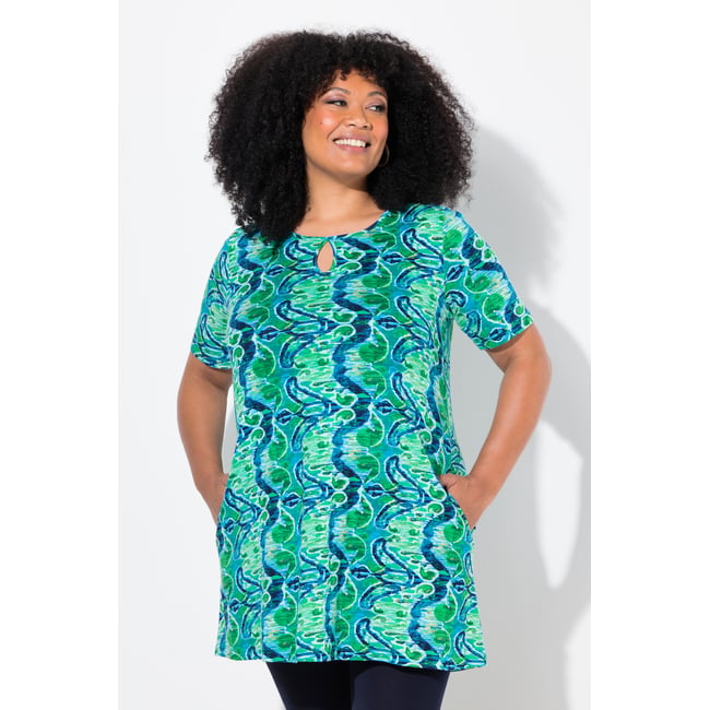 T-shirt long coupe évasée, poches trèfle <span itemprop=