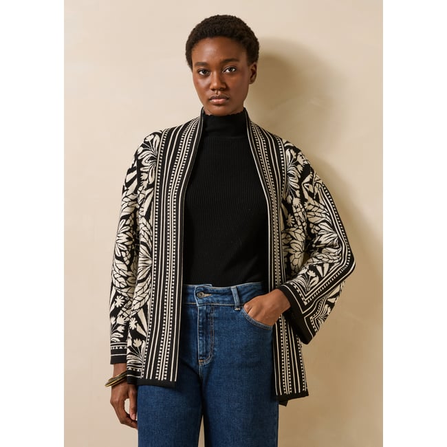 Gilet mi-long en maille jacquard bicolore noir/blanc <span itemprop=