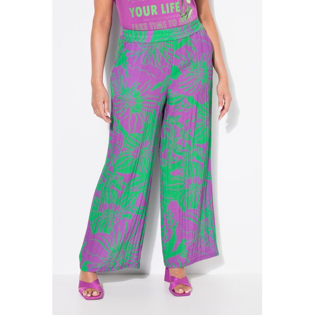 Pantalon à fleurs. Jambe large violet <span itemprop=
