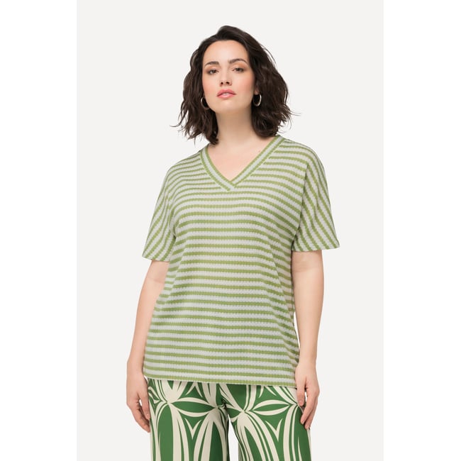 Sweat-shirt oversized bicolore à col V et vert mousse <span itemprop=
